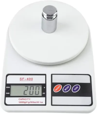 Digital Kitchen Scale SF-400 measuring a 200g metal calibration weight placed on its round weighing platform.