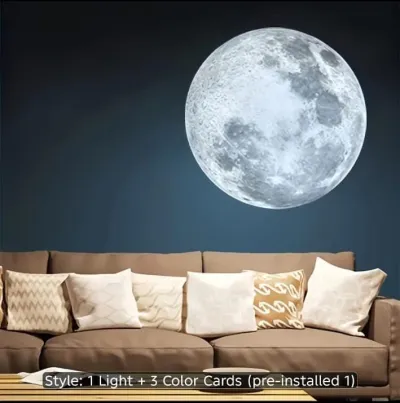 Moon Projection Lamp projecting a cool white detailed moon image on a dark wall behind a sofa.