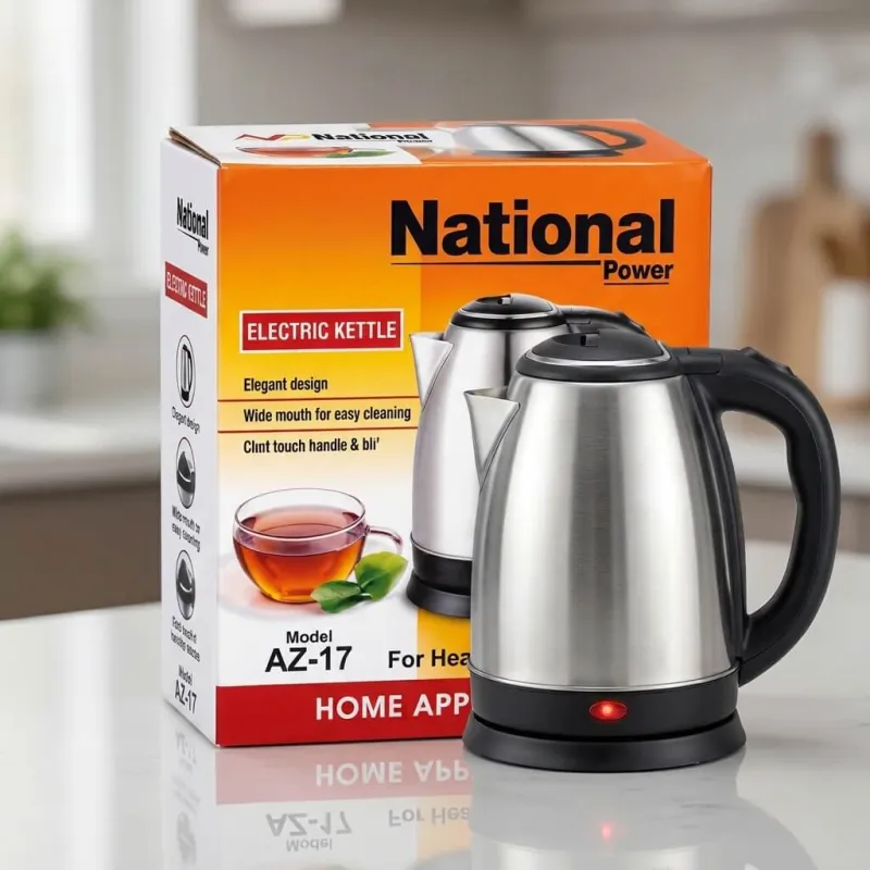 National Power Electric Kettle AZ-17 in stainless steel next to its orange product box on a kitchen counter.