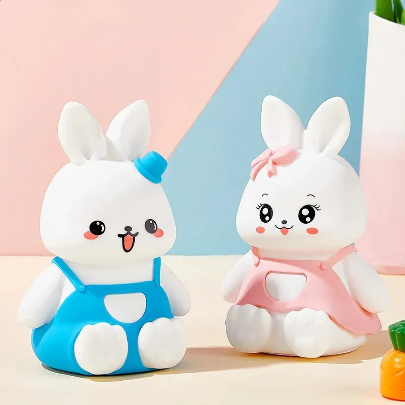Unlit Silicone Bunny Night Light set showing pink bunny in dress and blue bunny in overalls side by side.