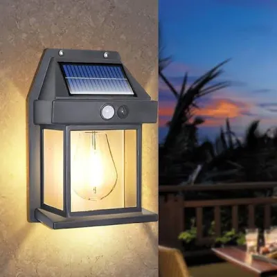 Solar Wall Light BK 888 mounted on a wall emitting warm light outdoors during dusk
