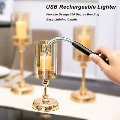 Hand holding a black USB Rechargeable Arc Lighter with flexible neck lighting a candle inside a glass holder.